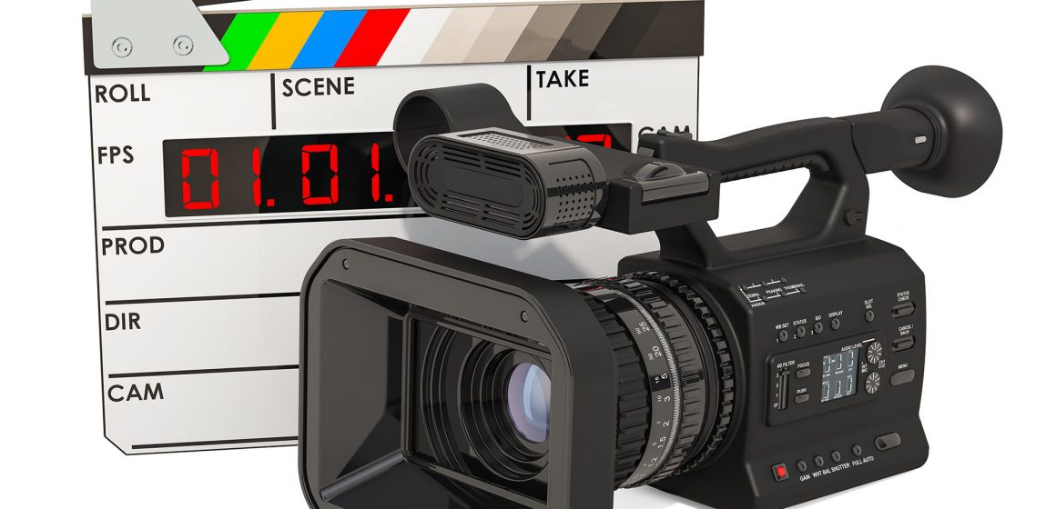Cinema concept. Professional video camera with digital clapperbo